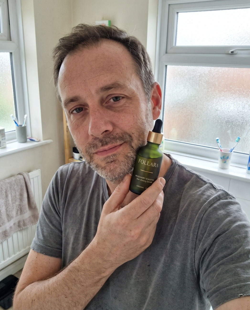 Customer holding his Follara bottle